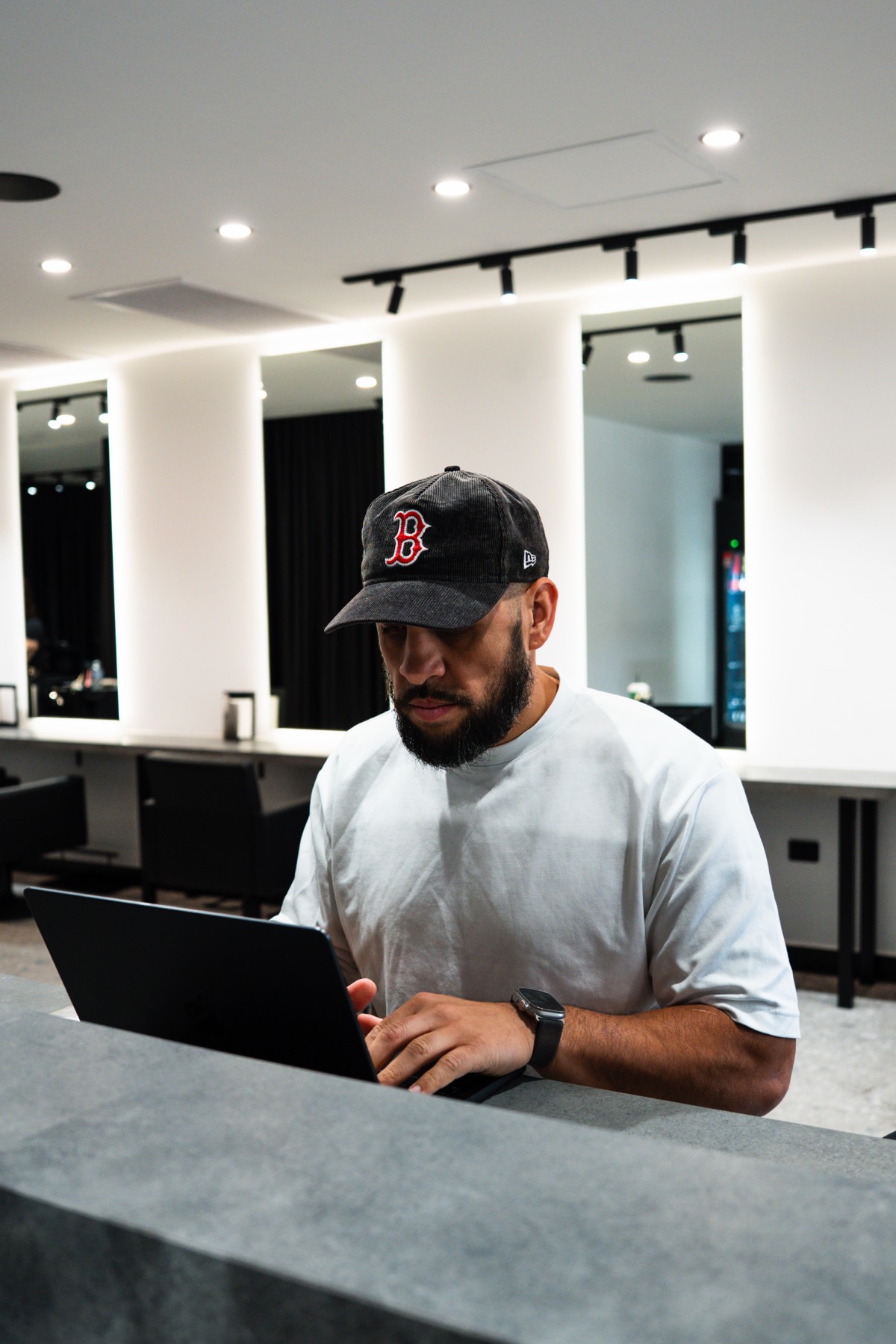 brogan berryman, founder of reps media, working on a laptop