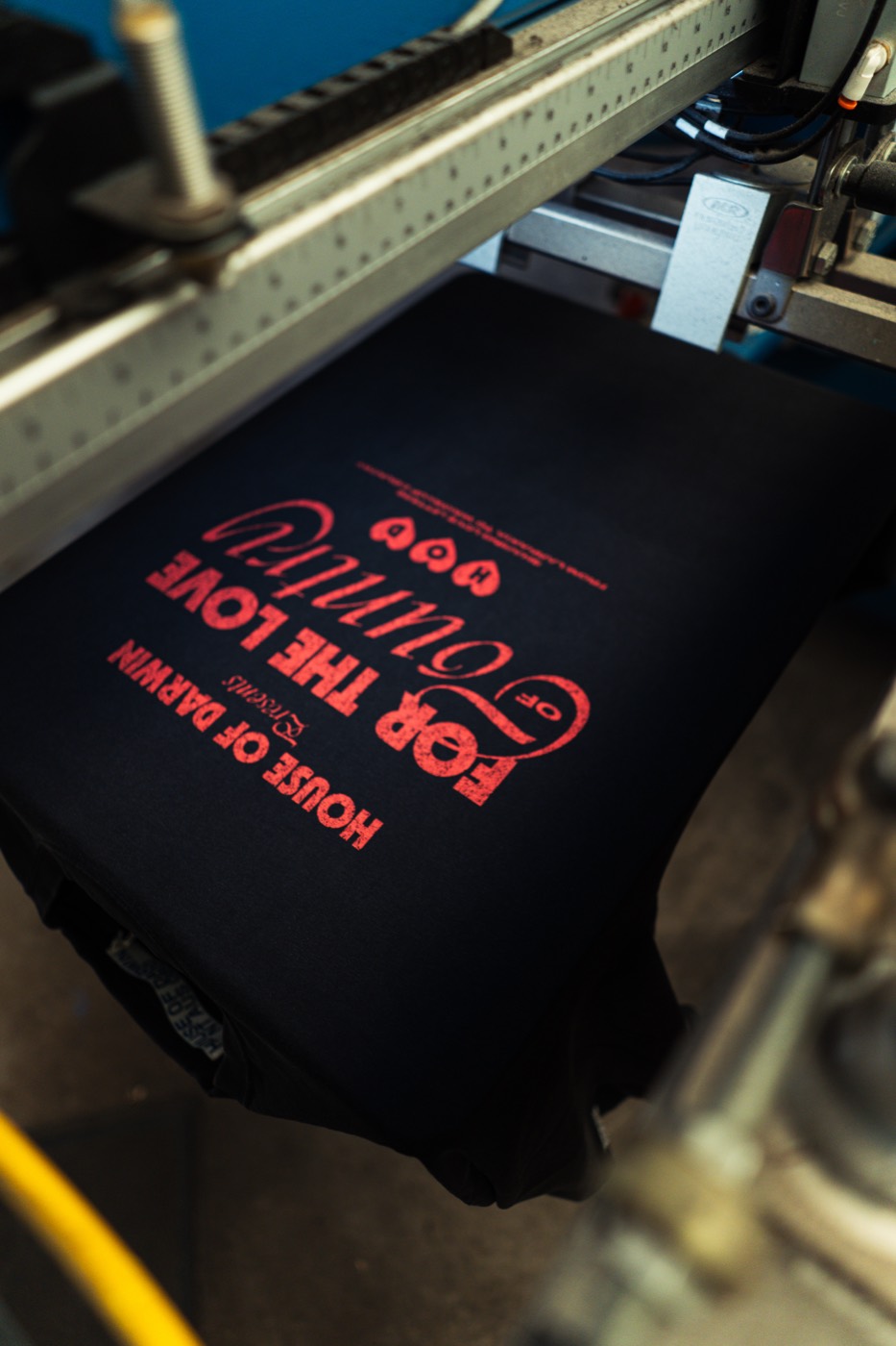 the finished house of darwin 'for the love of country' print on a black tee