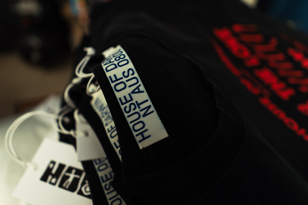 house of darwin branded neck tags on the printed tees